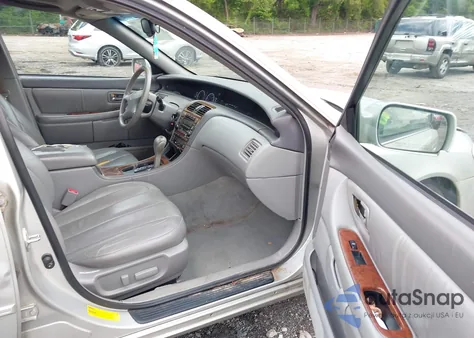 2001 Toyota Avalon Xls z USA, uszkodzony, nr VIN 4T1BF28BX1U191148